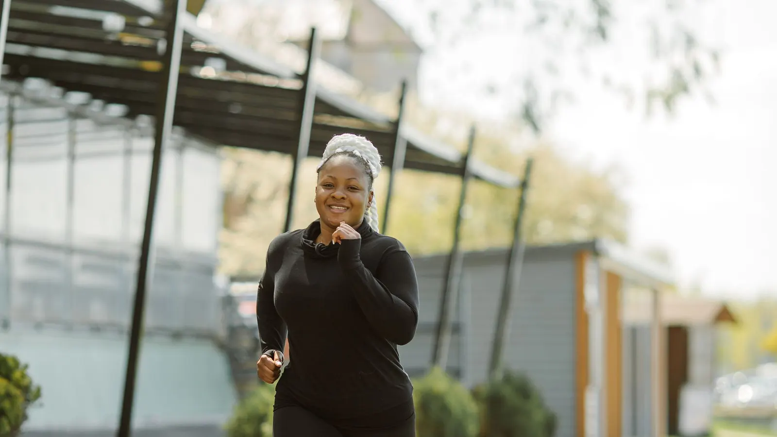 Woman jogging outdoors on a sunny path